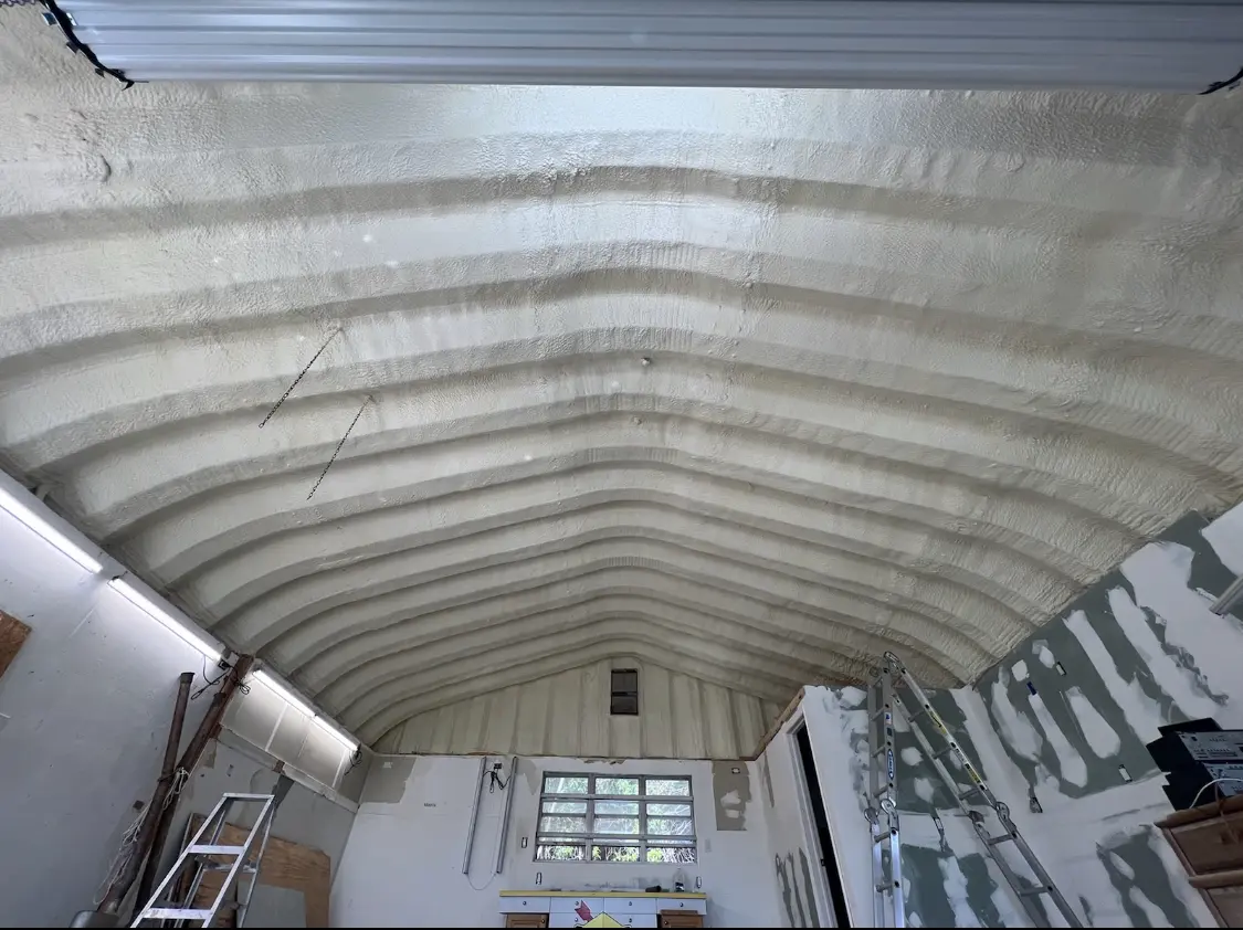Spray polyurethane foam applied to the underside of a metal roof deck in West Hanover